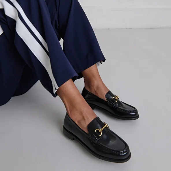 Loafers with gold bits in black leather