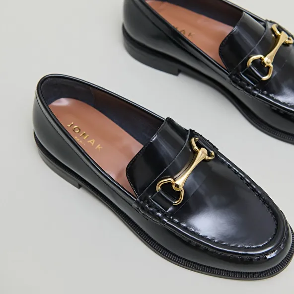 Loafers with gold bits in black leather