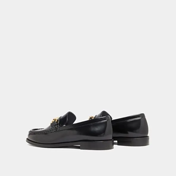 Loafers with gold bits in black leather